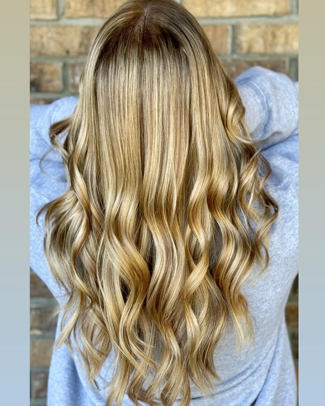 Golden honey blonde highlights with loose curls