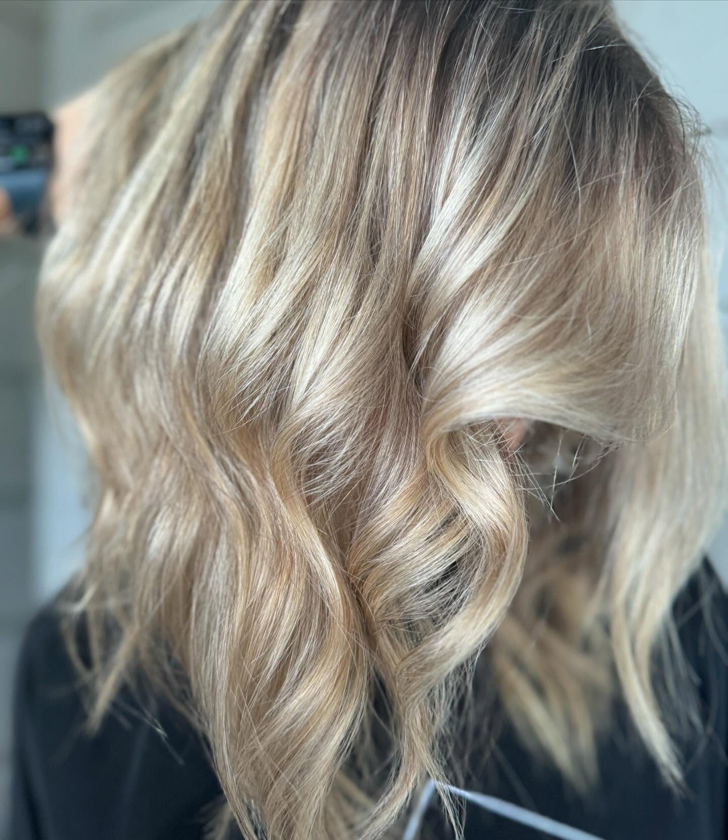 Platinum blonde waves with a soft blended root