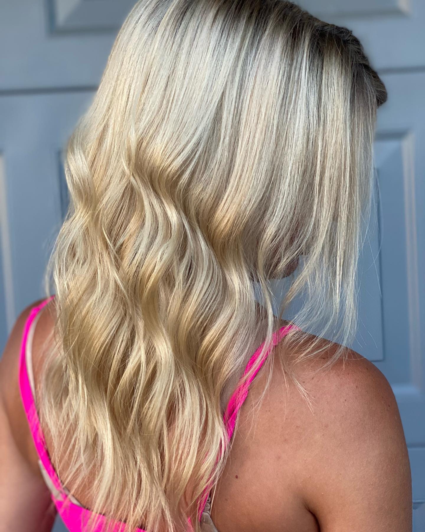 Icy blonde balayage with soft waves