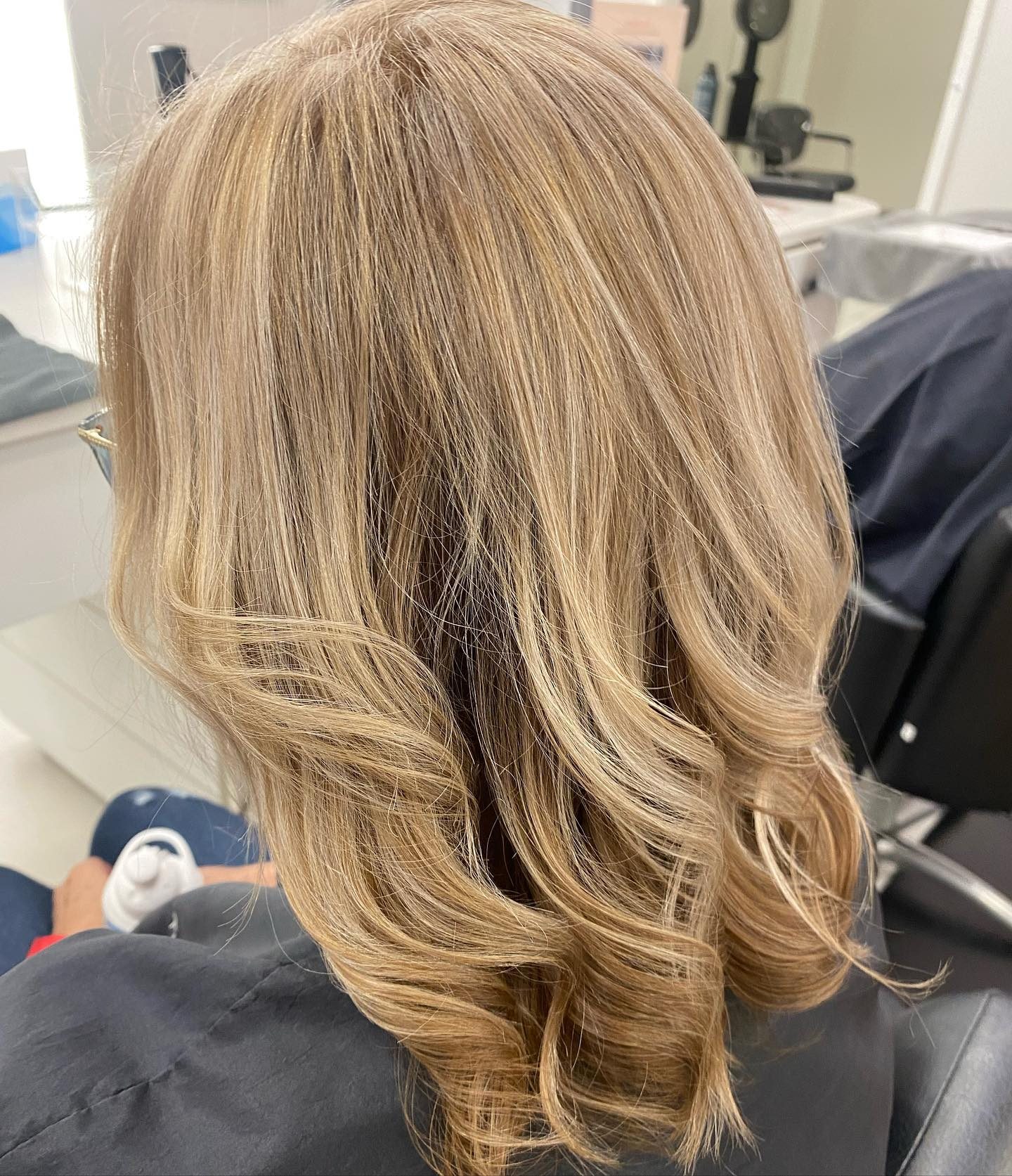 Warm blonde layers inside Tre Bella Salon, Longwood