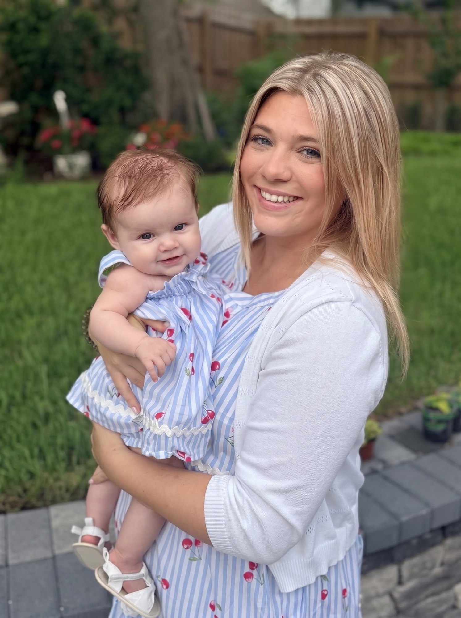 Alecee Sharp holding her daughter
