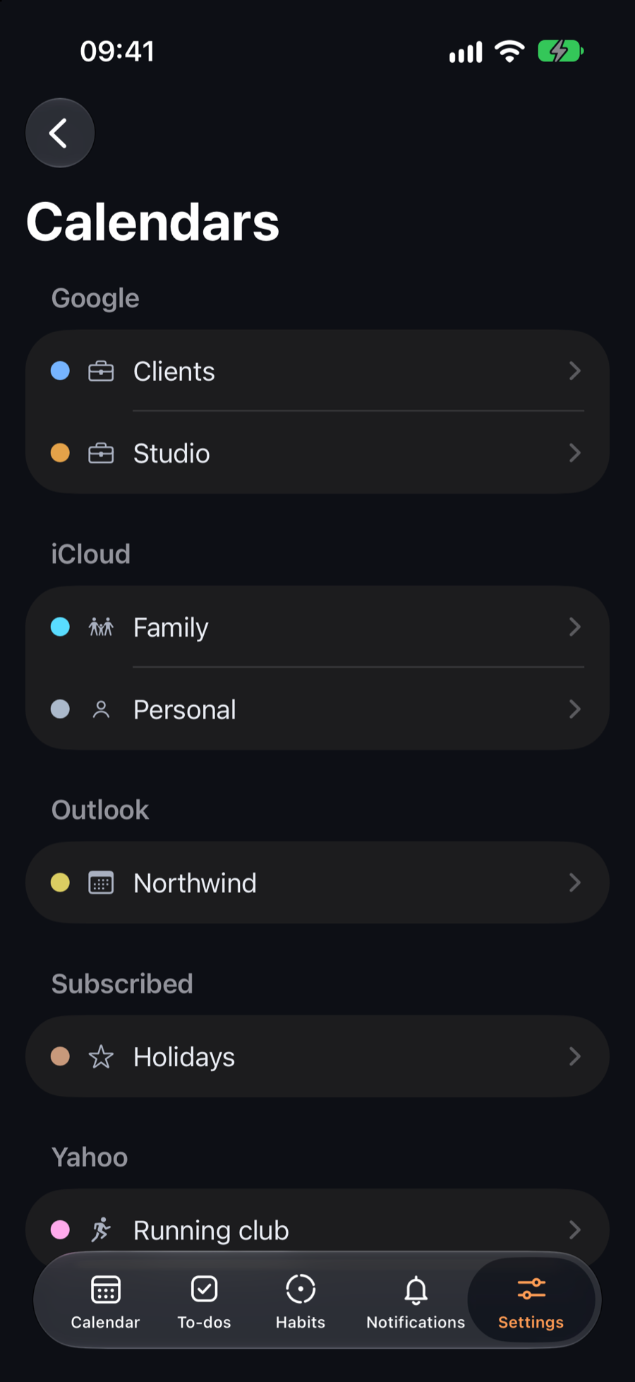 Calendars on iPhone grouped by account: Google, iCloud, Outlook, a subscribed holidays calendar and Yahoo