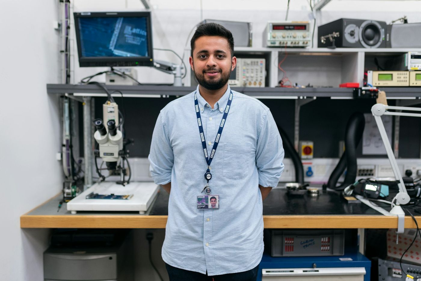 Engineer standing in a hardware lab