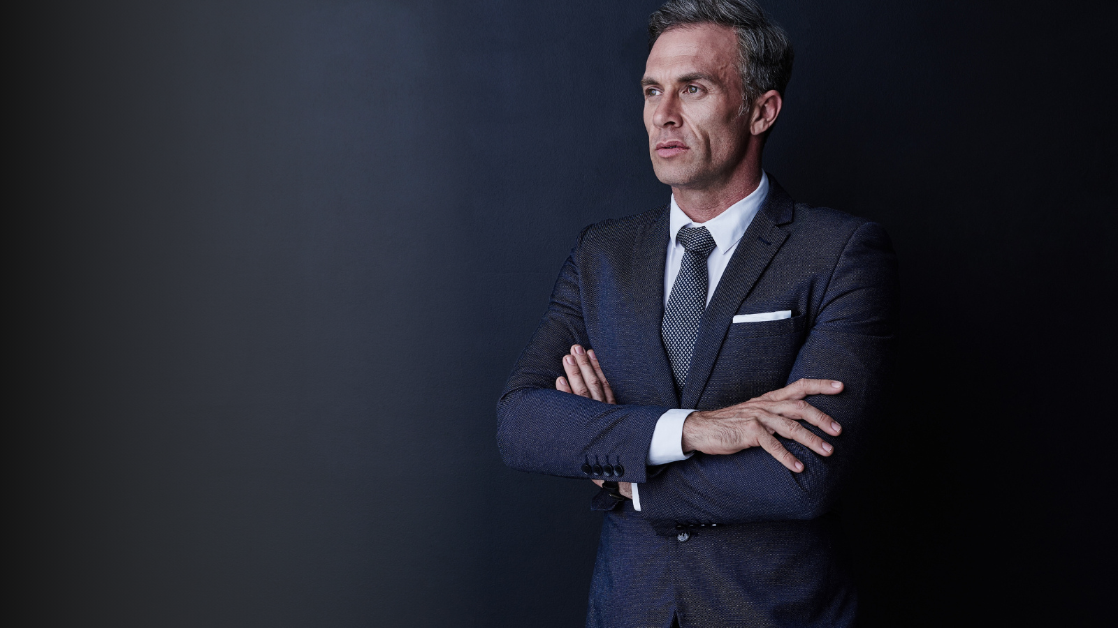 Senior executive in a navy suit