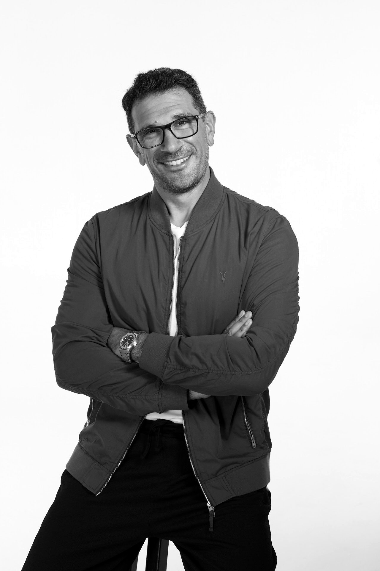 Daniel M. Jackson, sonic branding pioneer and author, arms folded and smiling