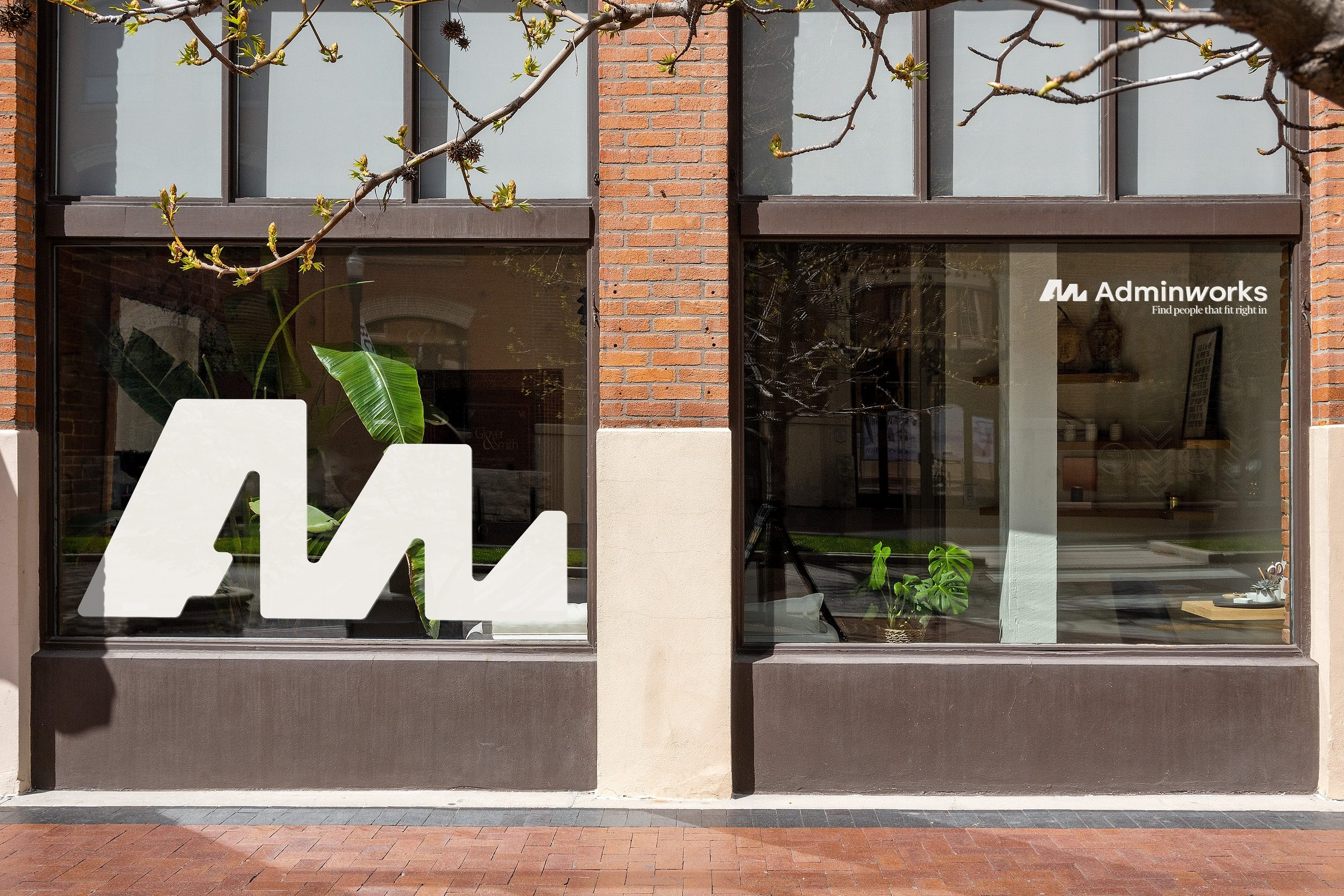 The mark, oversized across a shopfront window