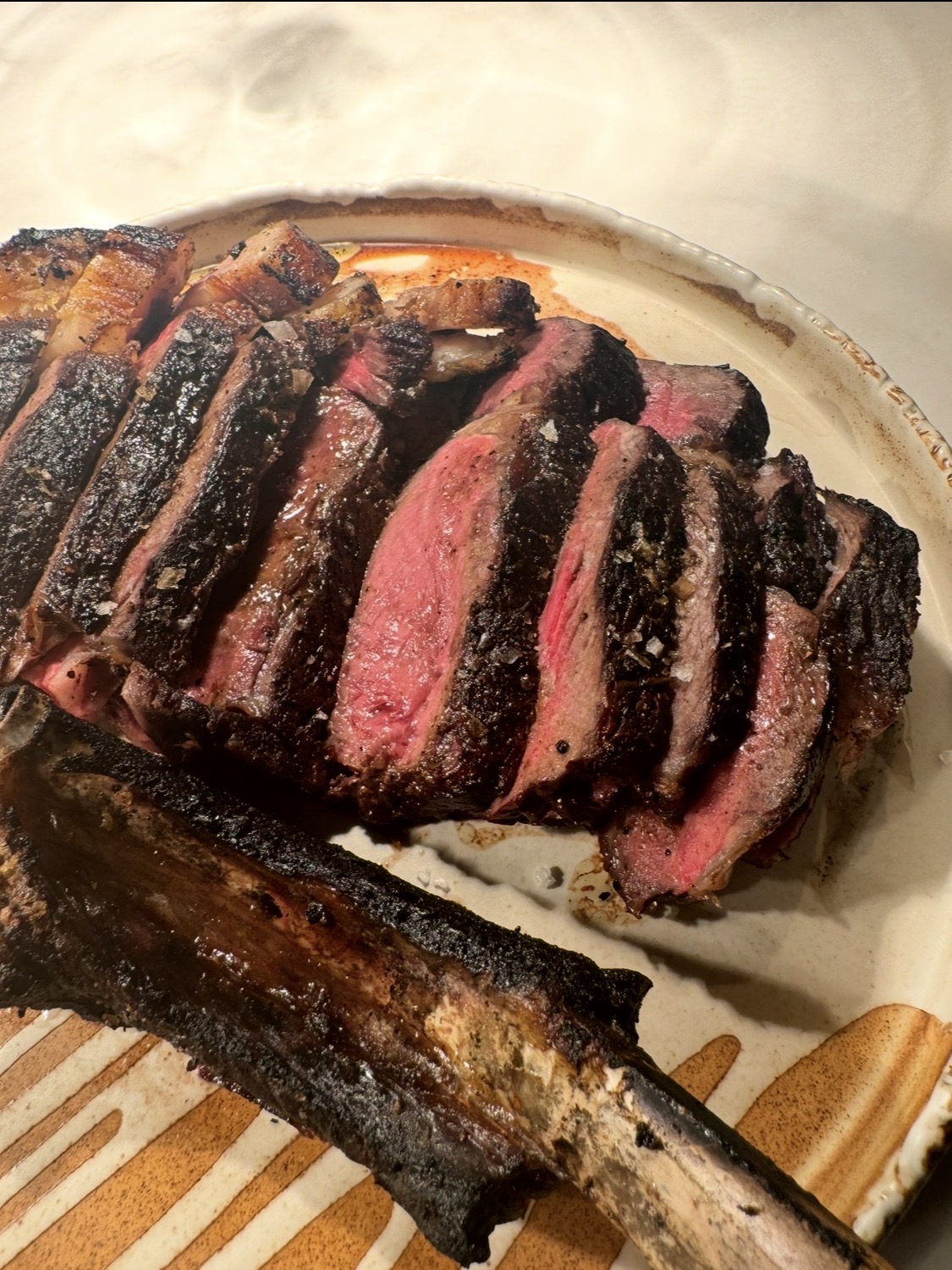 Carved tomahawk steak at Bazaar