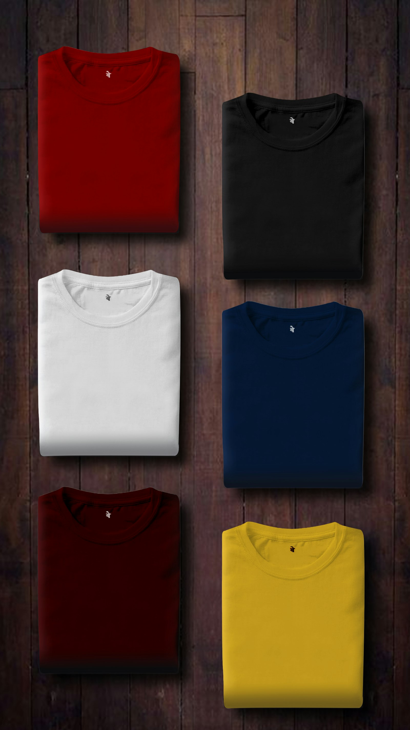Stack of folded t-shirts in assorted colours