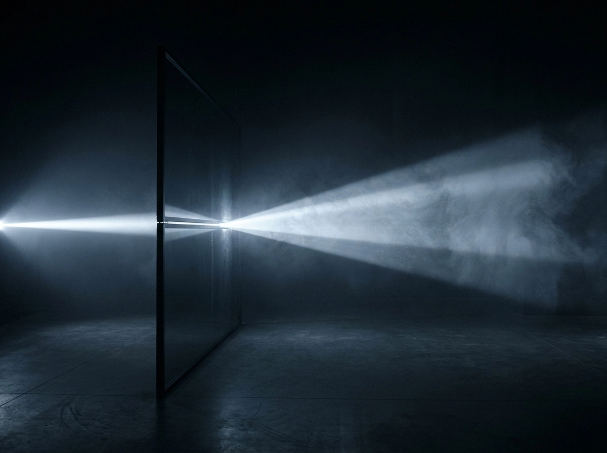 Bright light beam passing through a transparent glass panel in a dark room, creating visible rays of light and smoke on the right side.