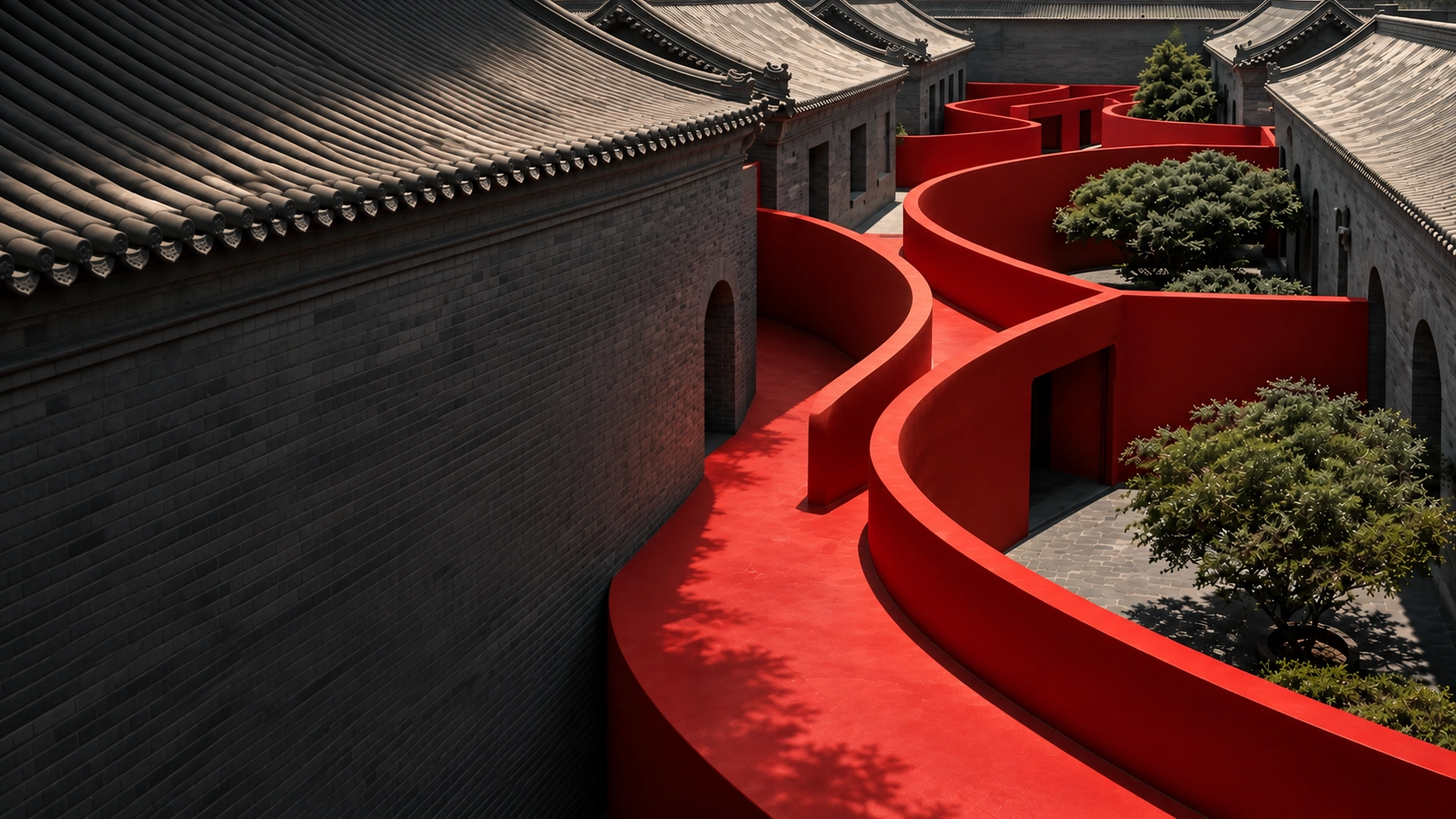 Curved red walkway winding between traditional gray brick buildings with tiled roofs, featuring arched doorways and landscaped with several green trees casting shadows.