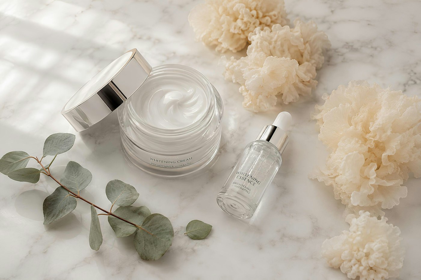 Skincare cream jar and serum bottle on marble