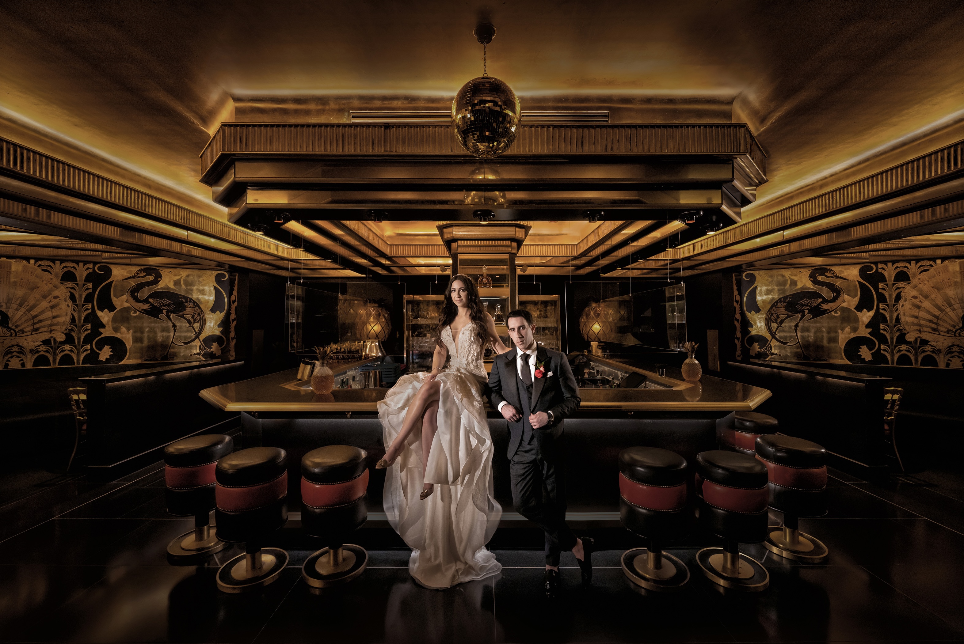 Muñoz Photography: bride and groom portrait at an Art Deco bar