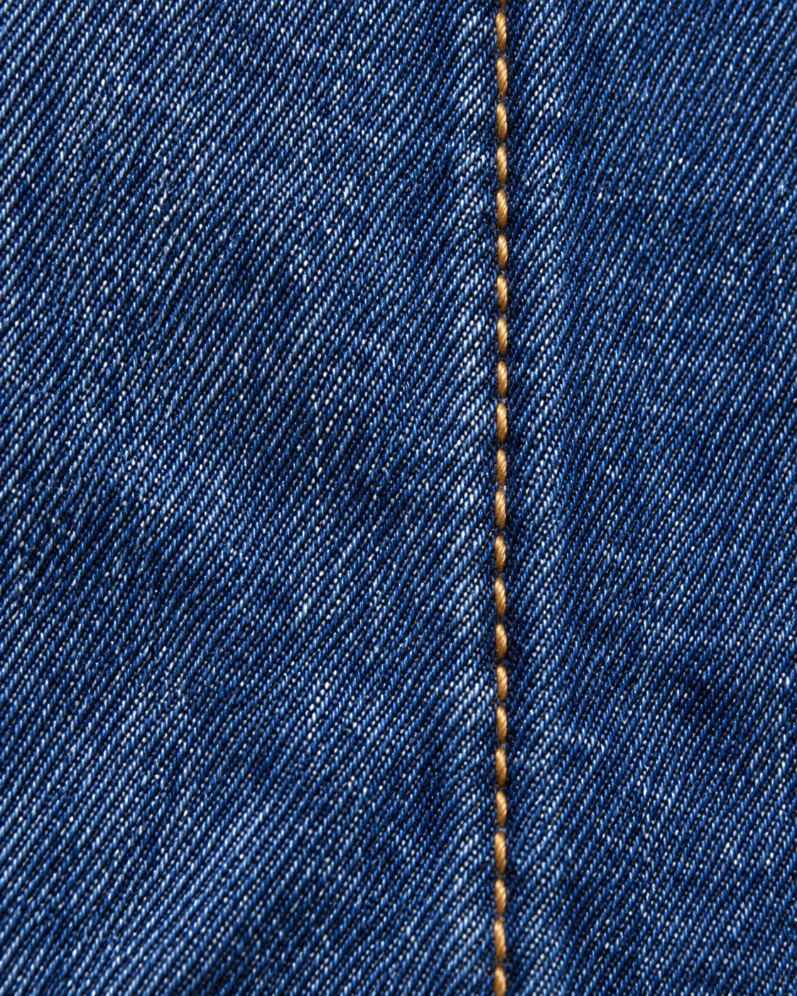Seam of dark indigo denim