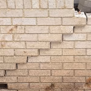 Wood forms and rebar set for a reinforced concrete retaining wall rebuild