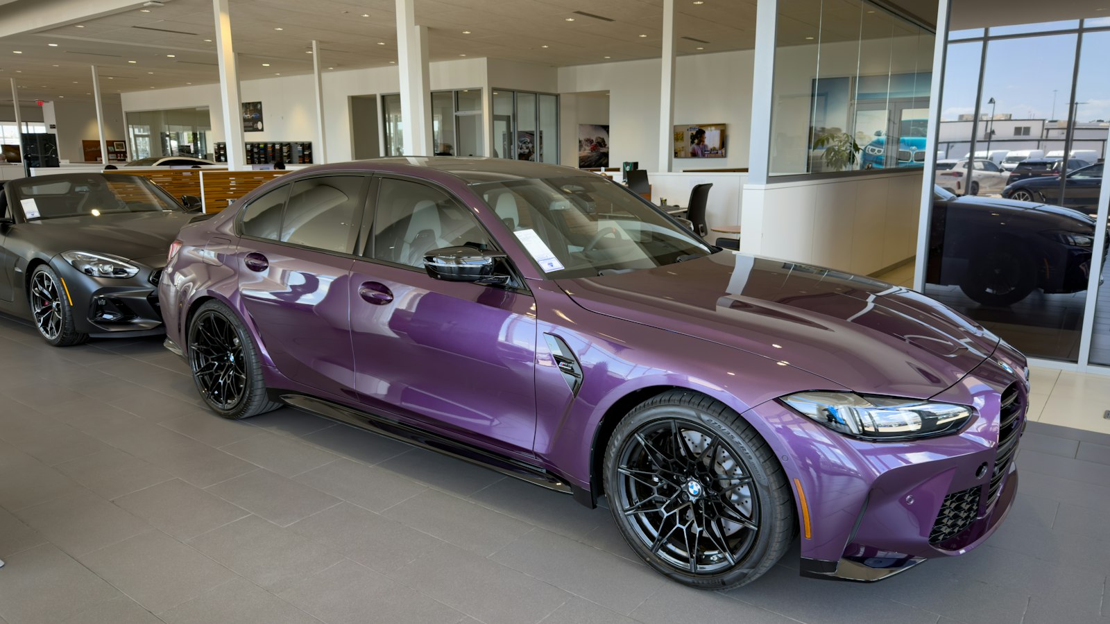 A car on display in a dealership showroom
