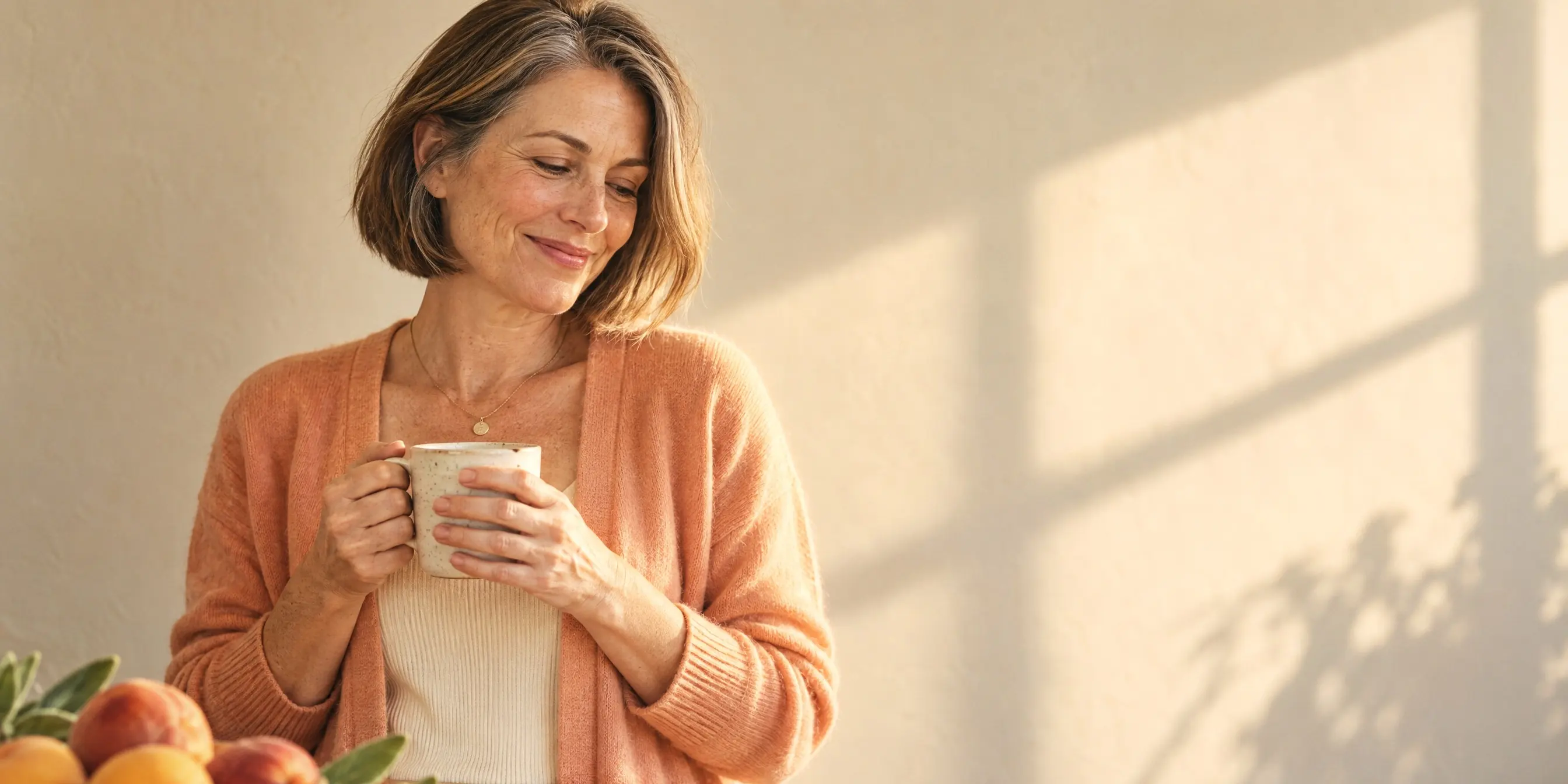 Woman smiling softly in warm morning light