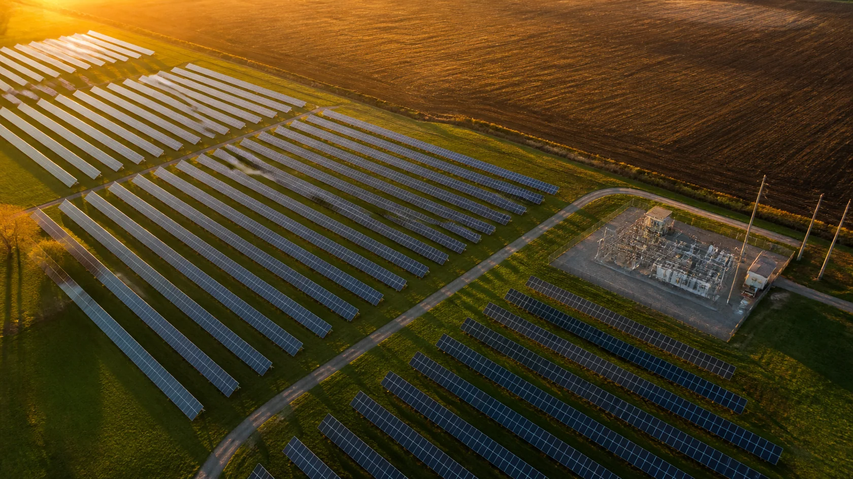 Aerial view of a solar farm with its substation