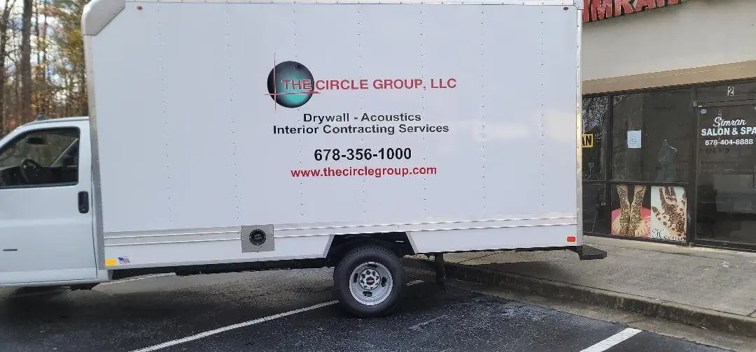 Vehicle graphics on a white box truck
