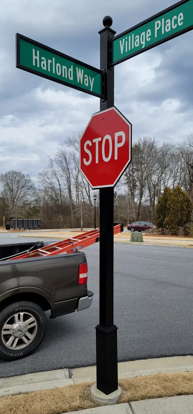 Decorative subdivision street name sign with stop sign