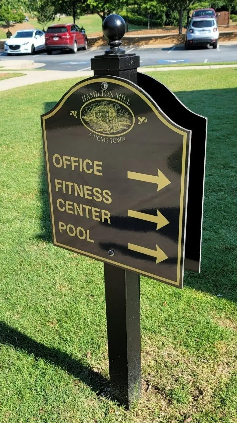 Black directional post and panel sign