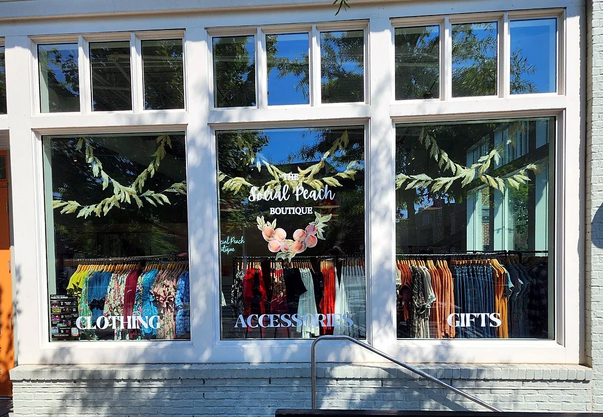 Storefront window graphics for The Social Peach Boutique