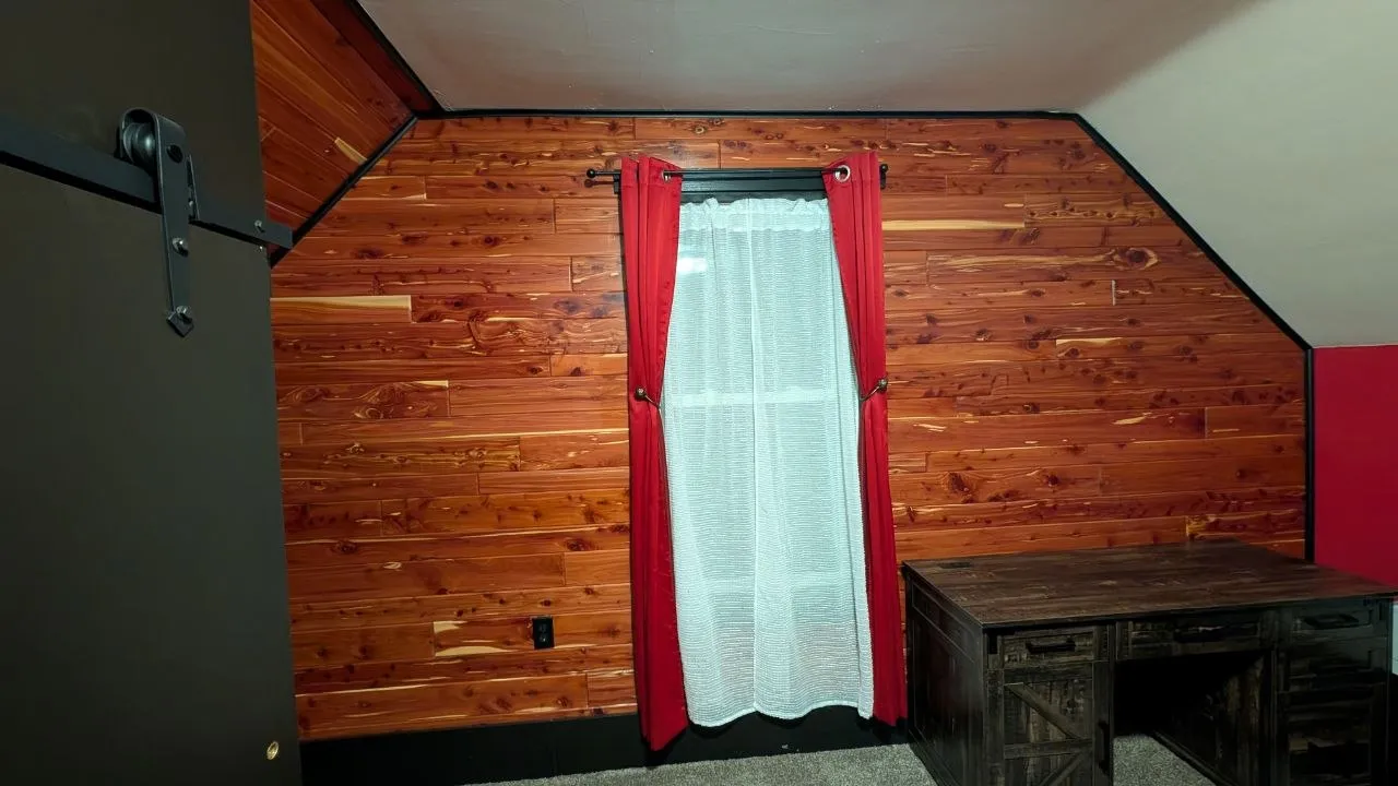 Finished attic bedroom with cedar accent wall