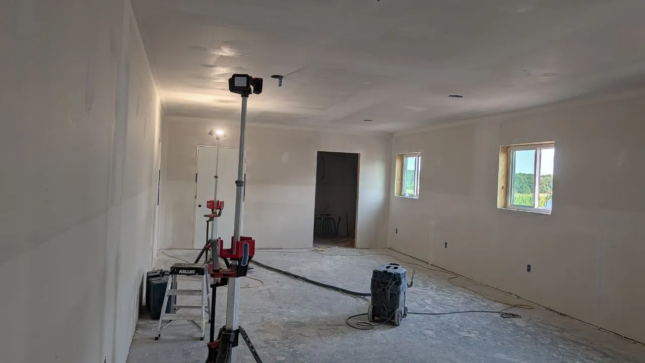 Large room with drywall hung and taped