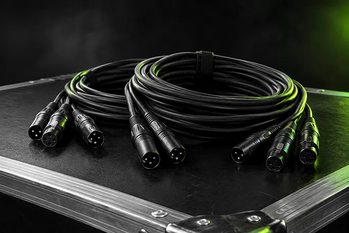 Bundle of DMX lighting cables with 3-pin XLR connectors on a road case