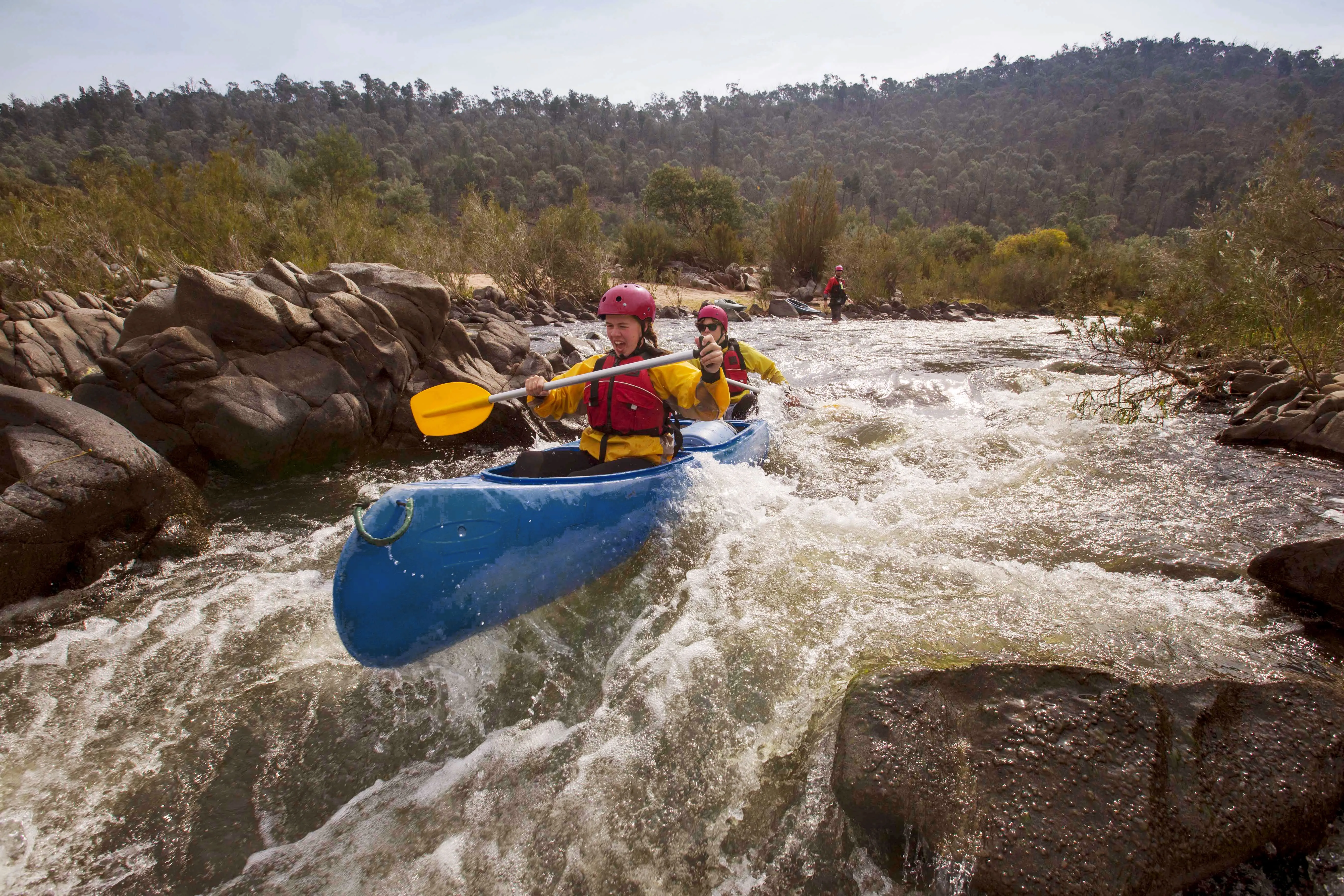 Kayaking through white water
