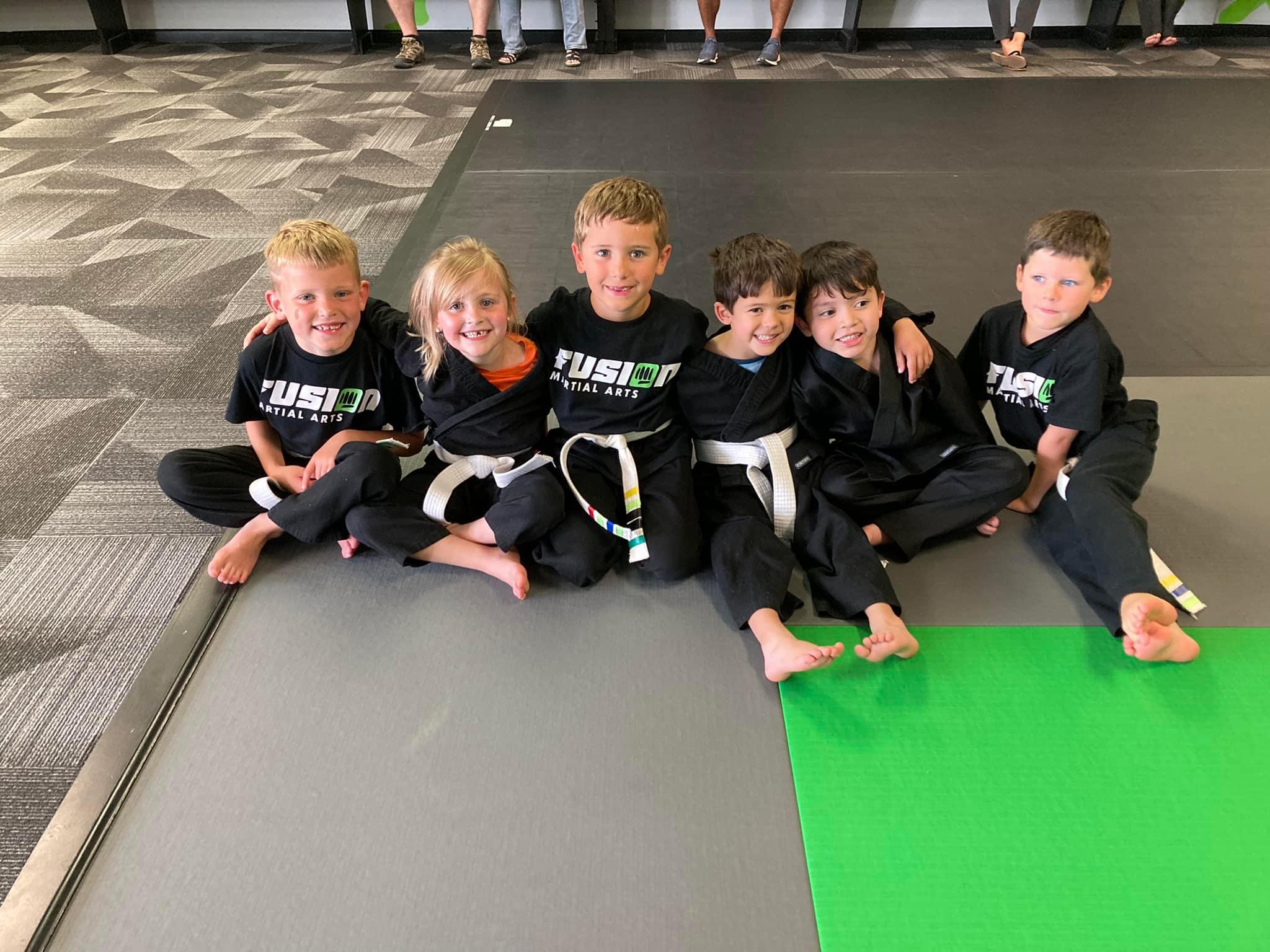 Kids class gathered on the mats at Fusion Martial Arts in Bloomington, IL