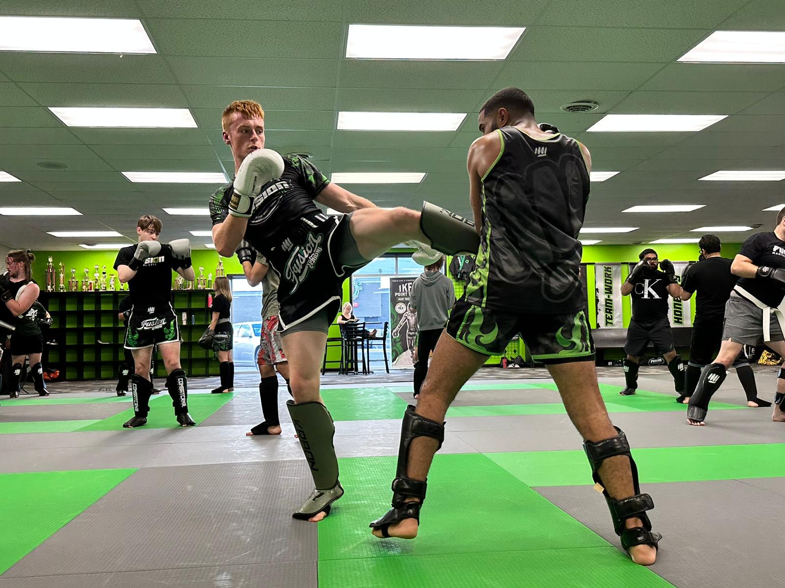 Adult Muay Thai kickboxing training at Fusion Martial Arts in Bloomington, IL