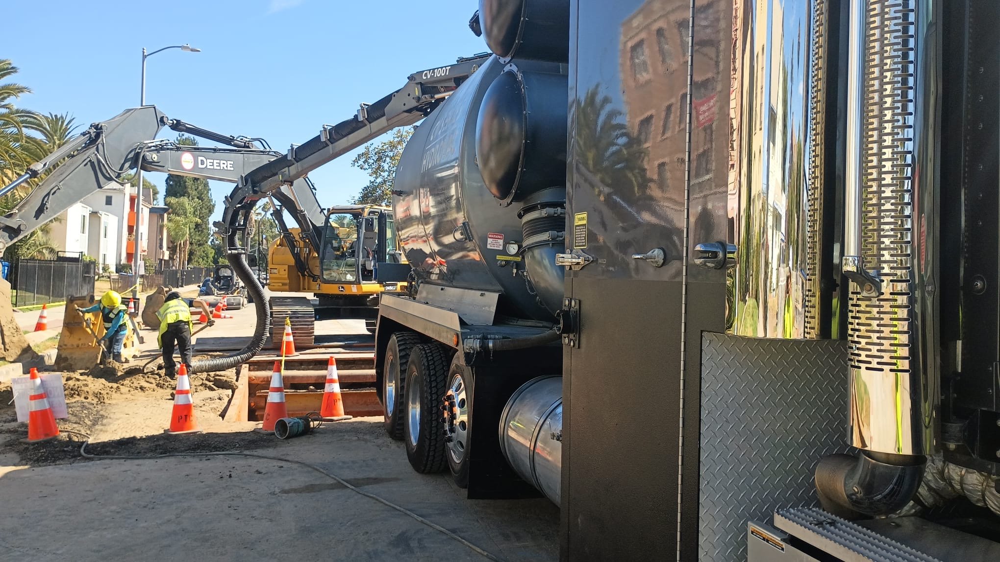 Hydrovac potholing to expose utilities in a street
