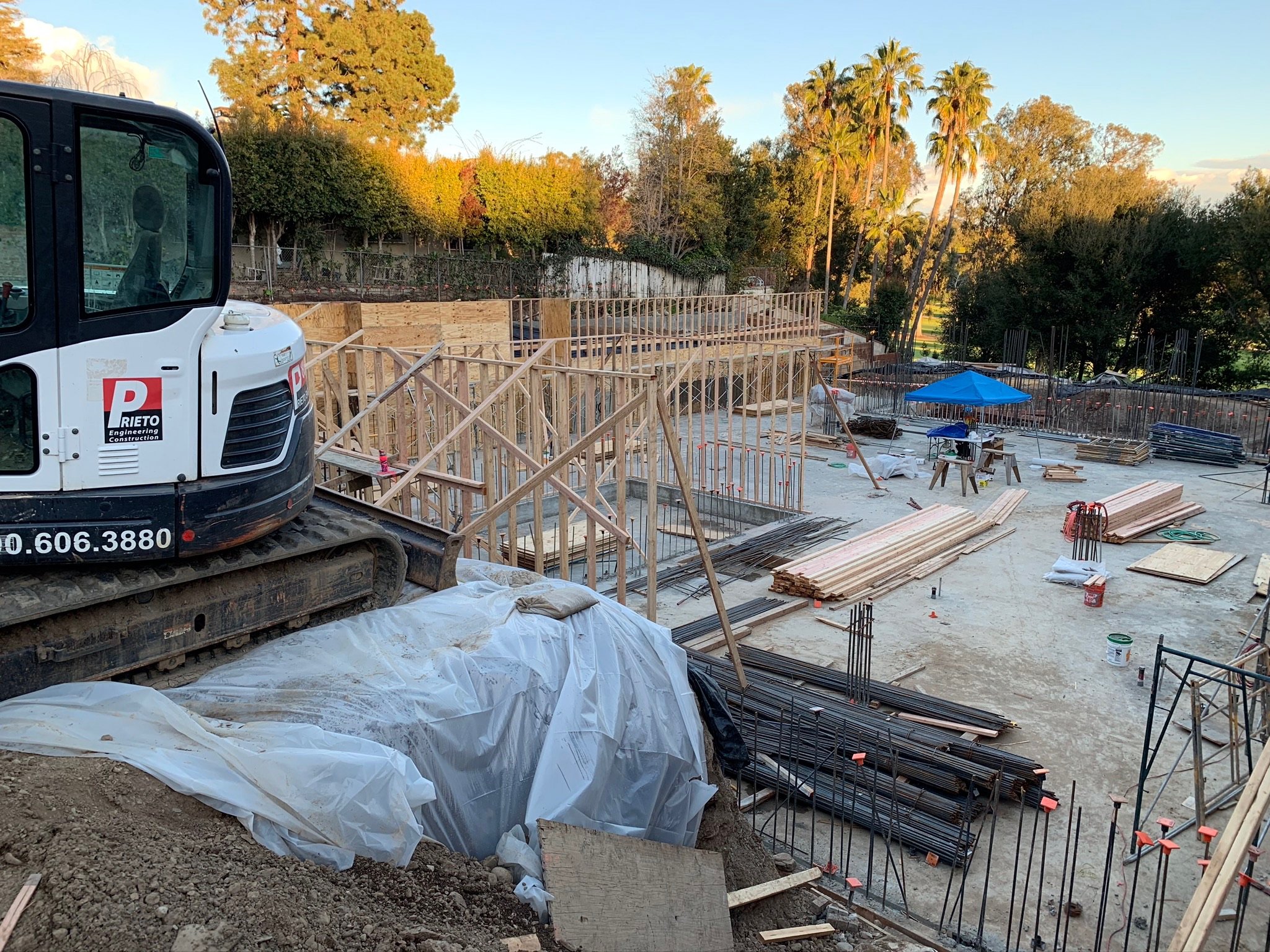 JFPEC excavator at a foundation forming job