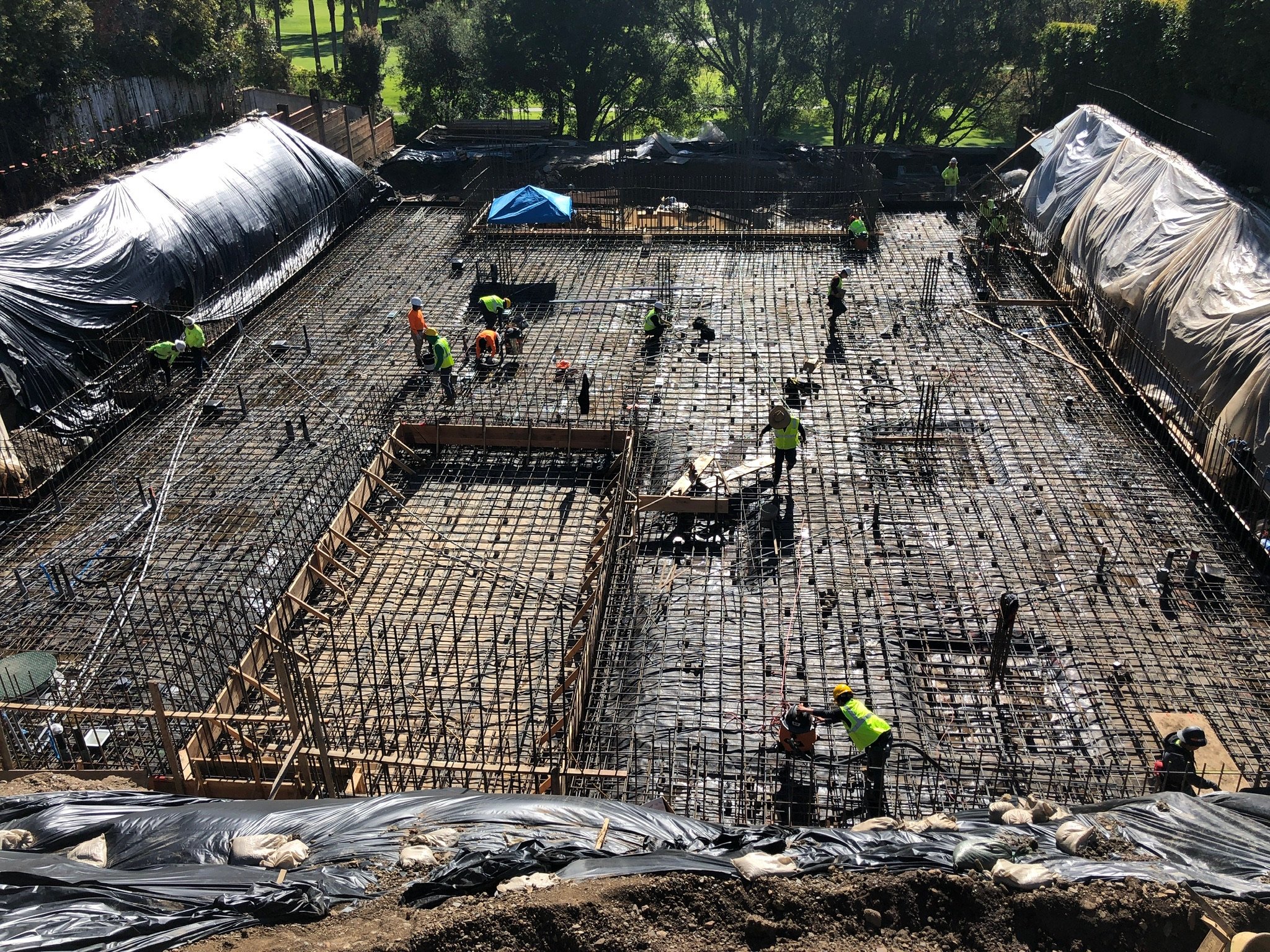 Crew tying rebar for a mat foundation