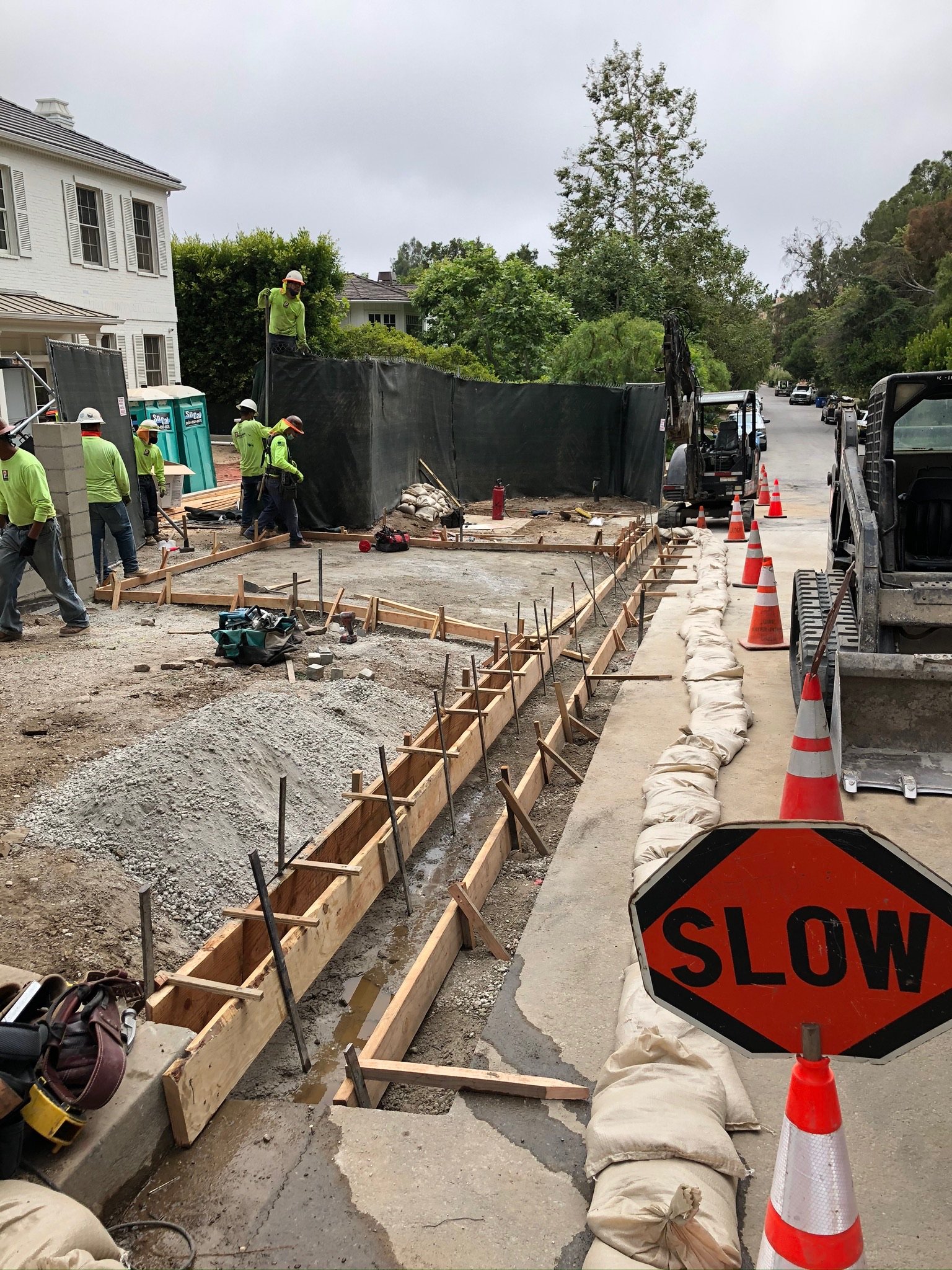 Curb forms with traffic control in place