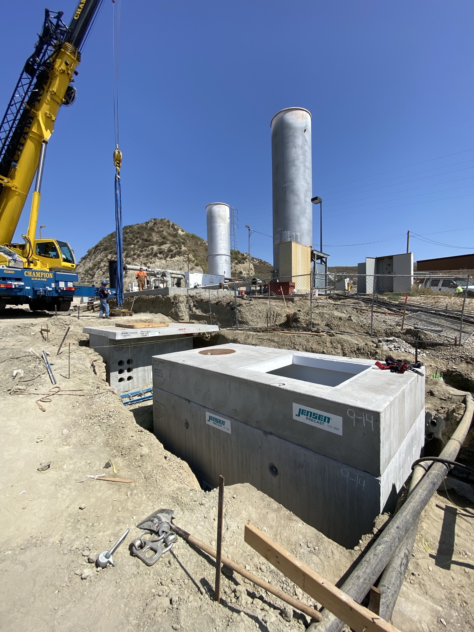 Precast Edison underground vaults set by crane at a landfill flare station