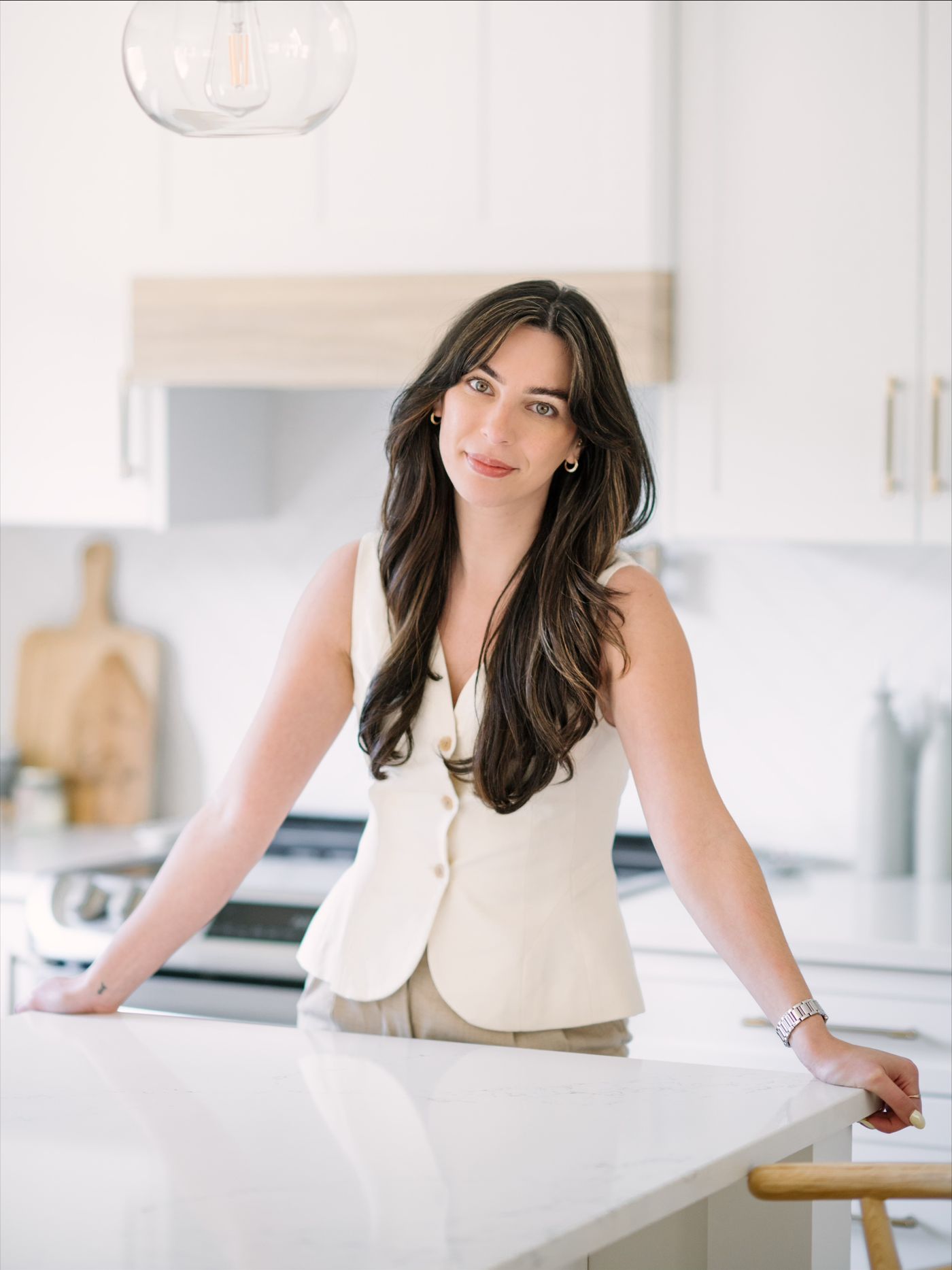 Jessica leaning on a kitchen island