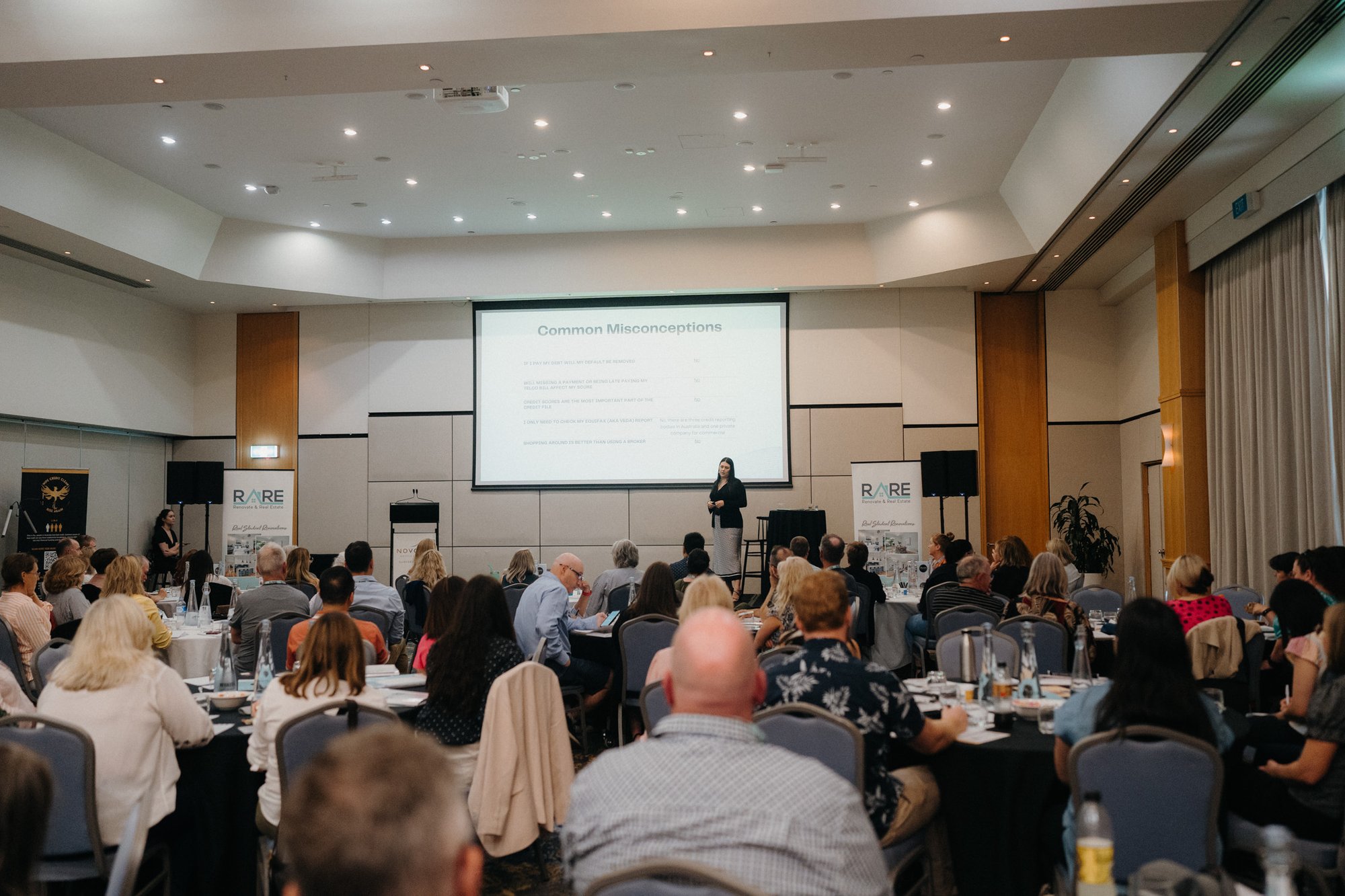 Larni speaking to a full room
