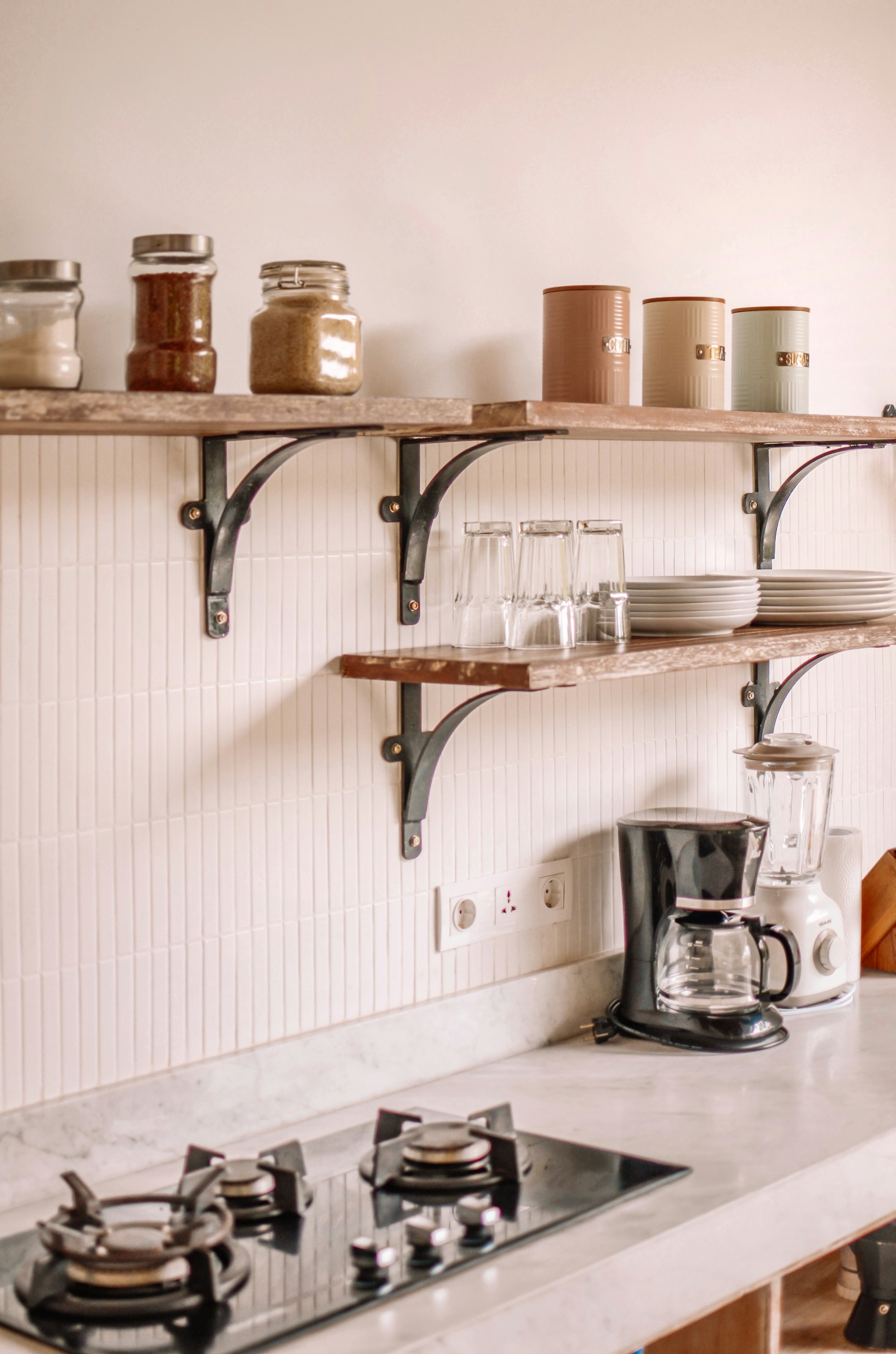 Galley kitchen with painted cabinets and open shelving