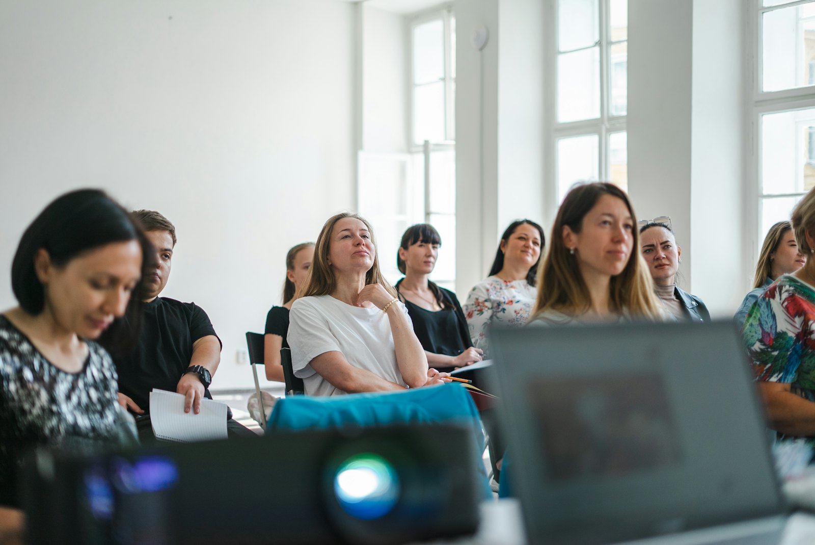 Participants listening closely during a training session