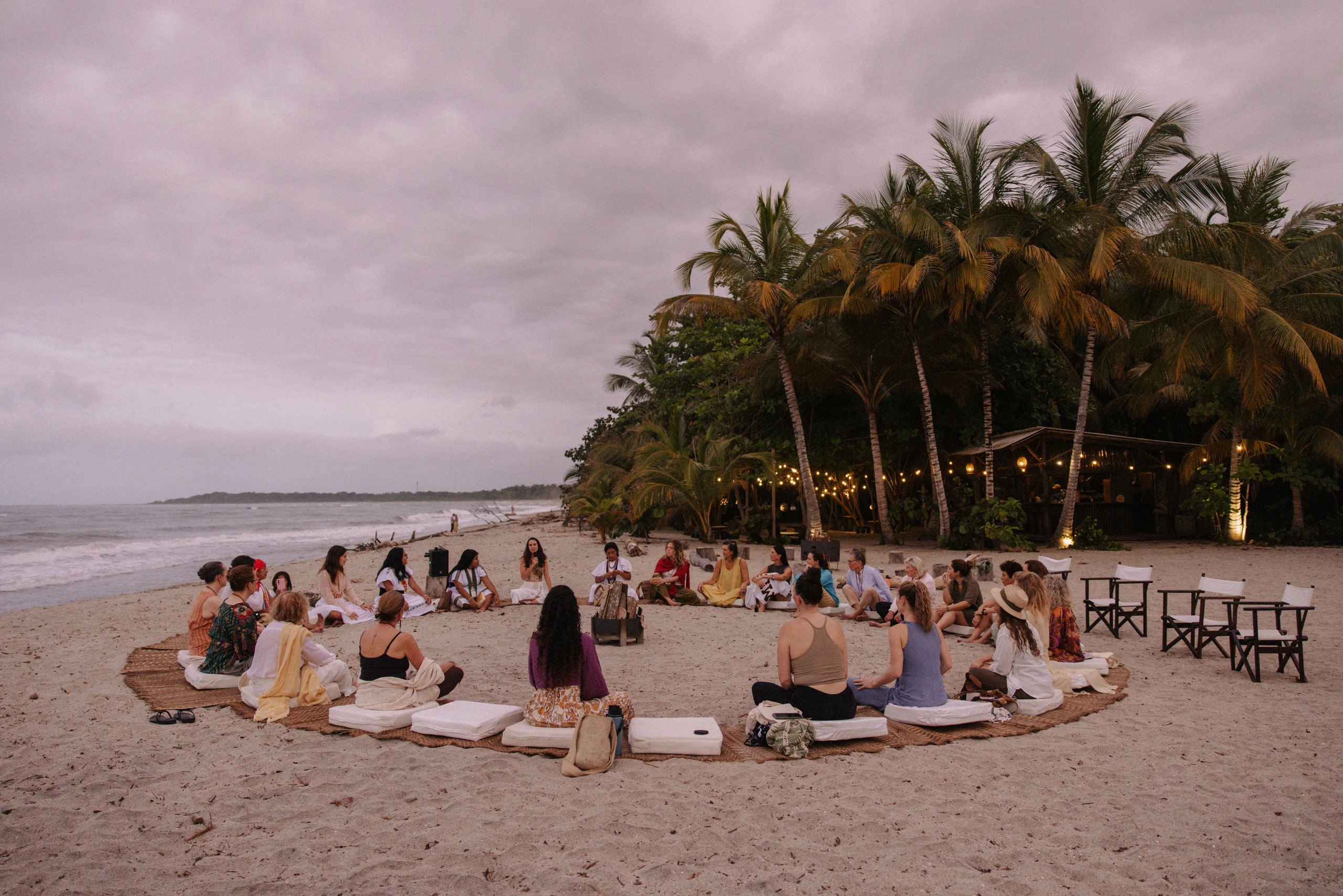 Project Dandelion community members forming a circle on Sierra Nevada Beach