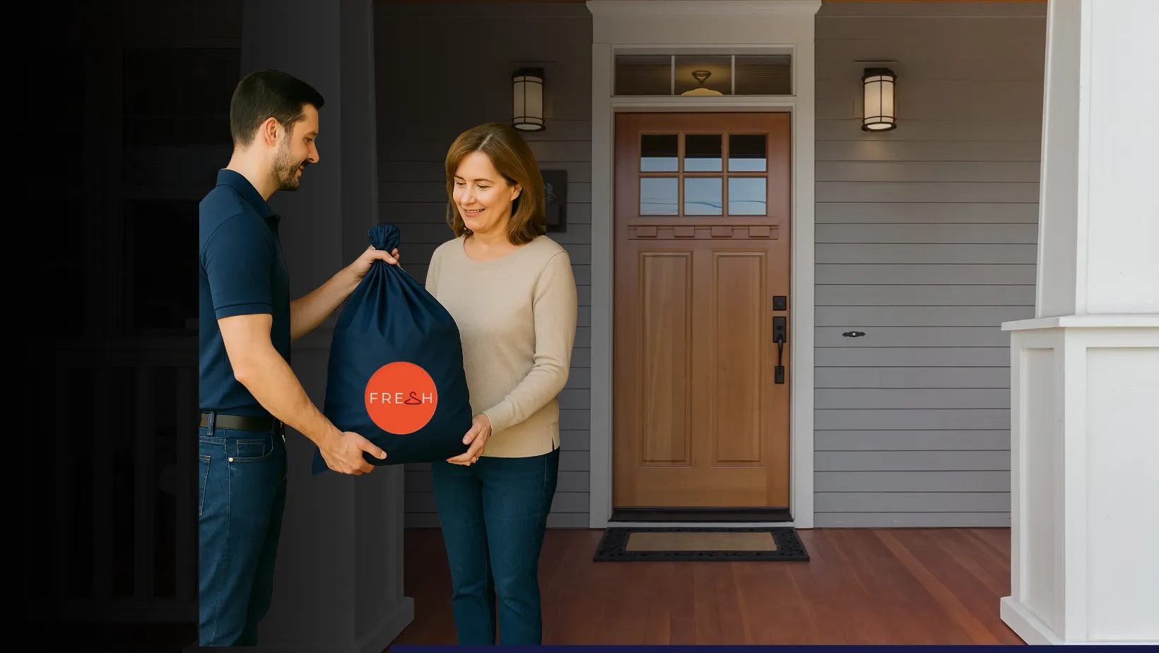 A Fresh driver handing a laundry bag to a customer at her front door