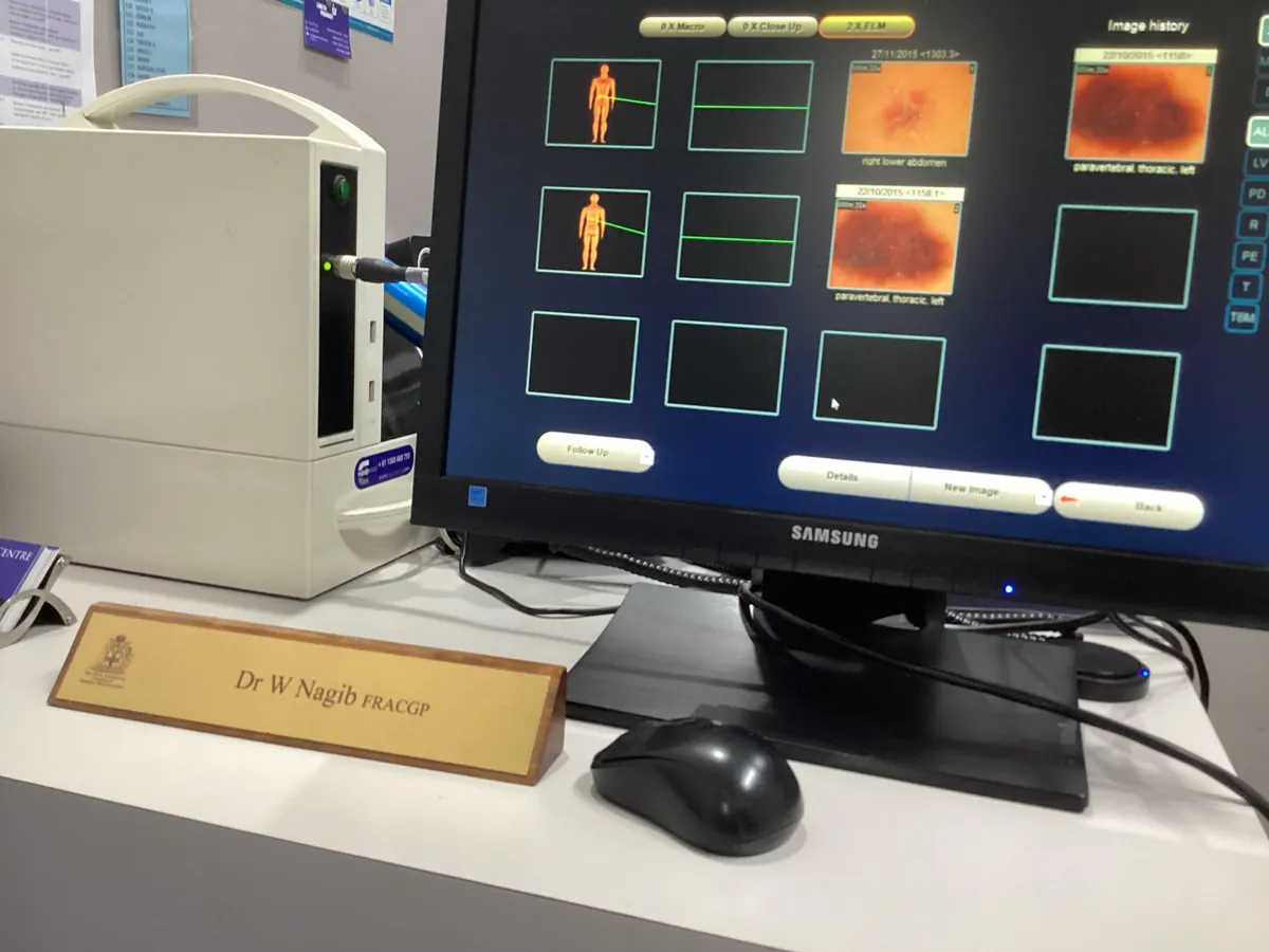 Dr Nagib's desk with his skin imaging equipment and name plate