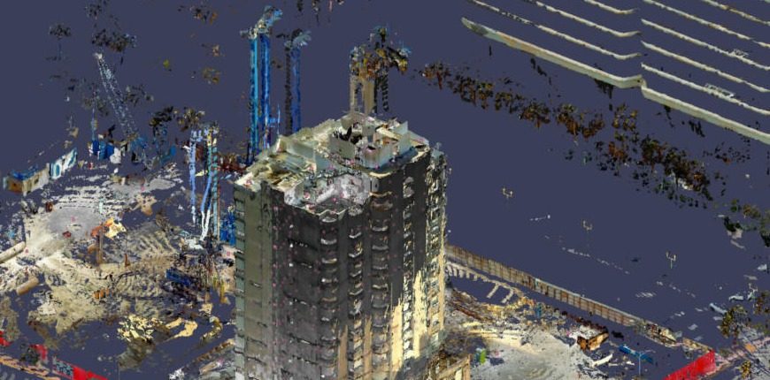 Progress scan showing cranes and pile rigs on site