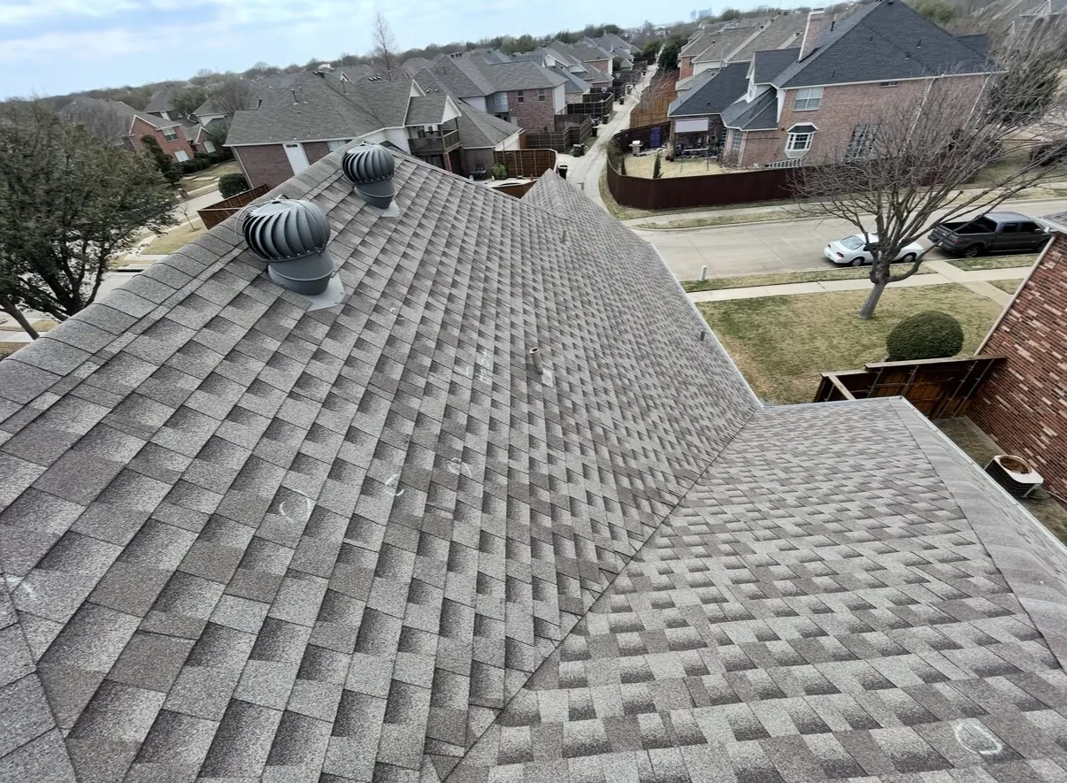 Shingle roof with turbine vents and chalk-circled hail hits marked during inspection