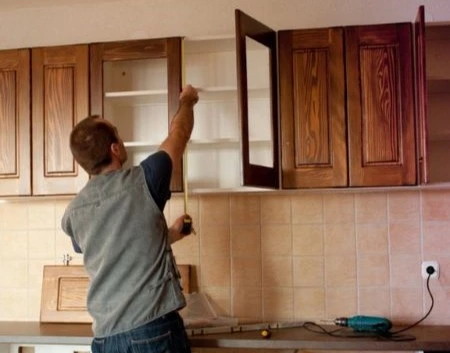 Kitchen cabinets being installed during a remodel