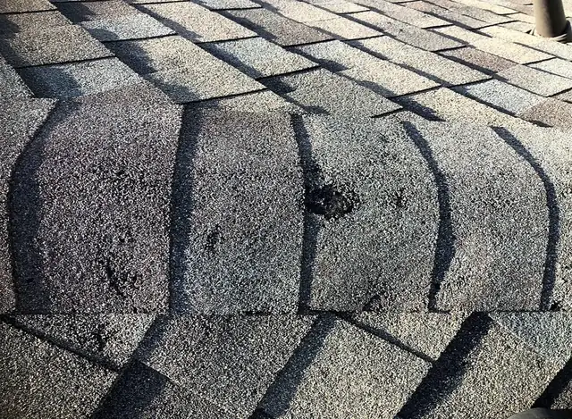 Impact marks on ridge cap shingles