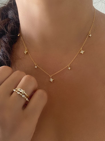 Gold station necklace and rings