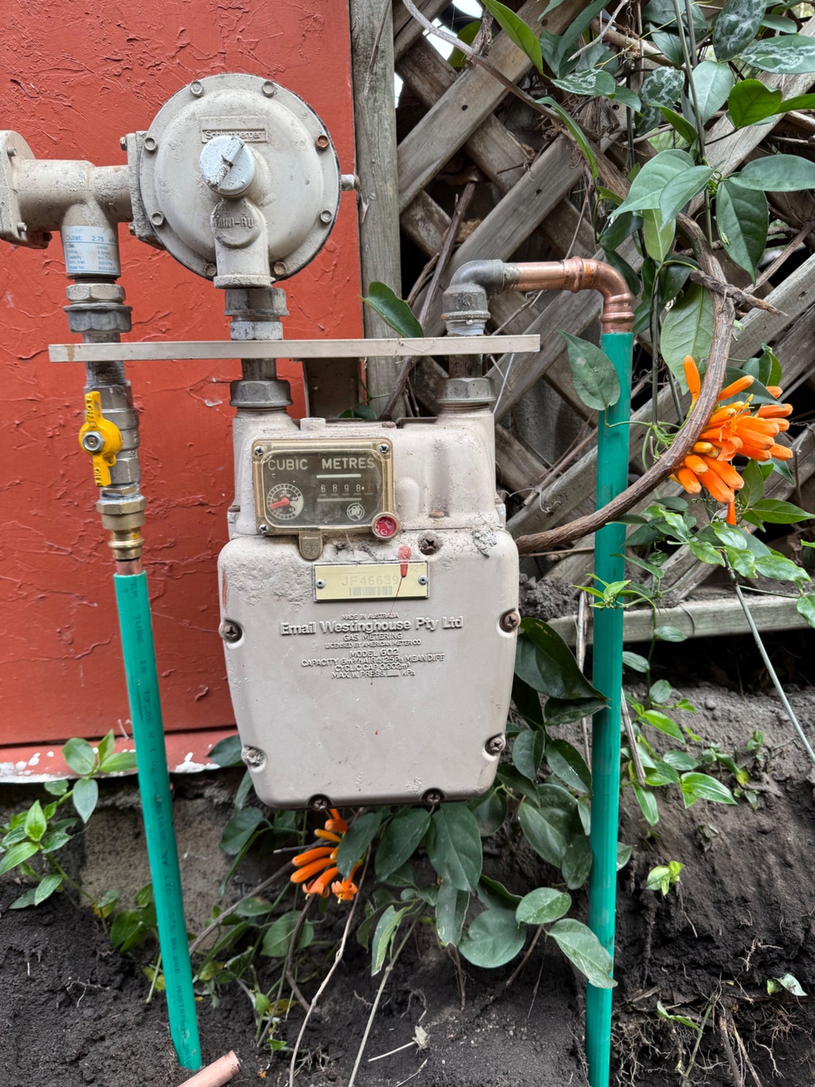 Relocated gas meter and regulator with new copper gas pipework on the side of a home in Unanderra