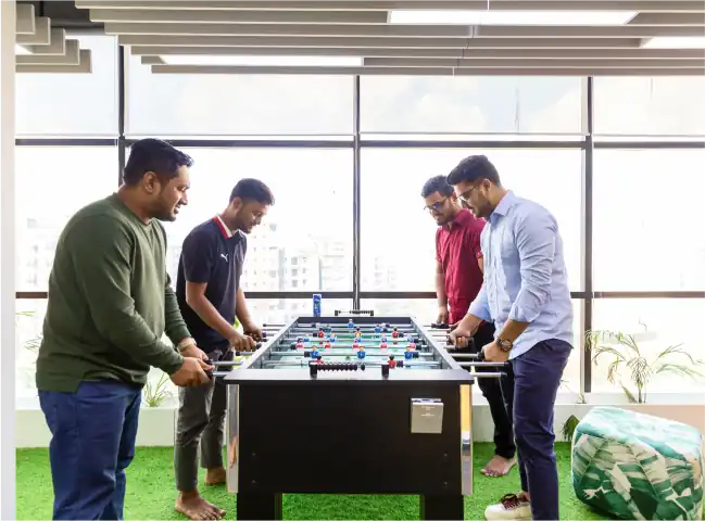 Musemind team playing foosball in the office